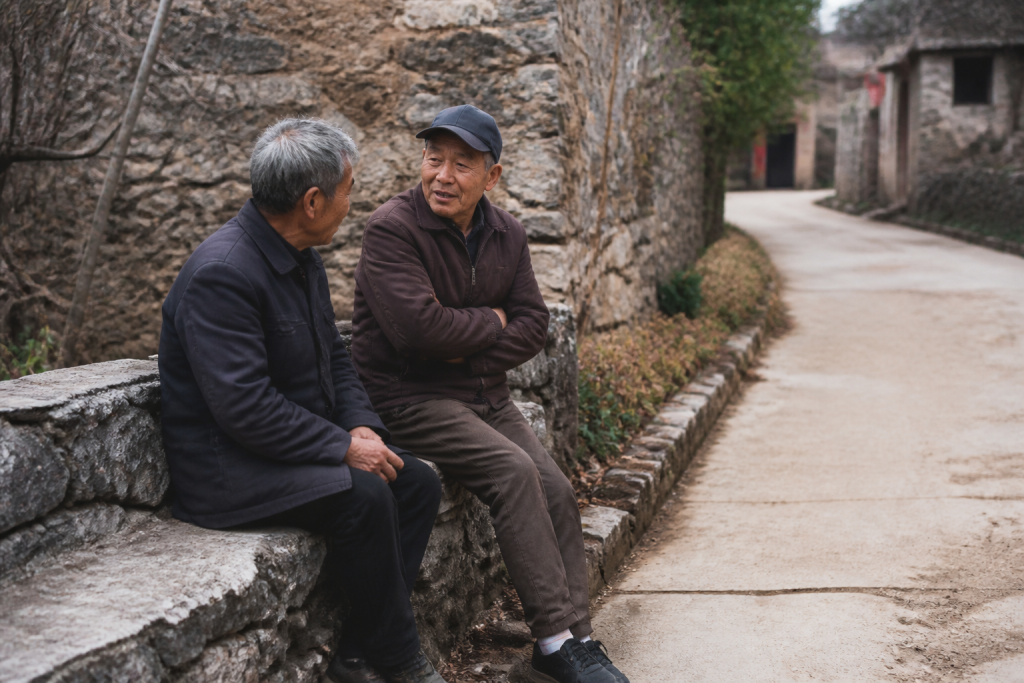Residents chatting peacefully on quiet village street