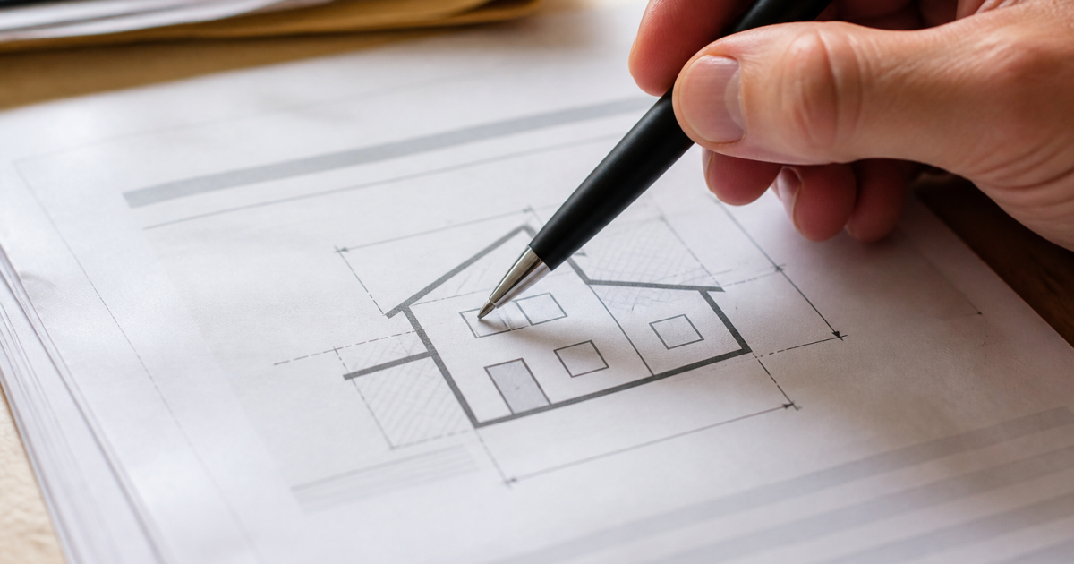 Document fiscal montrant superficie maison avec stylo pointant